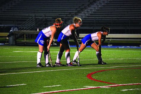 Claire Buckey, Grace Buckey and Mara Hunter line up for a corner.