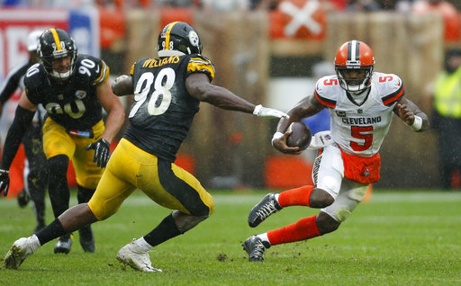 Cleveland Browns quarterback Tyrod Taylor (5) scrambles against Pittsburgh Steelers linebacker Vince Williams (98) during the first half of an NFL football game, Sunday, Sept. 9, 2018, in Cleveland. (AP Photo/Ron Schwane)