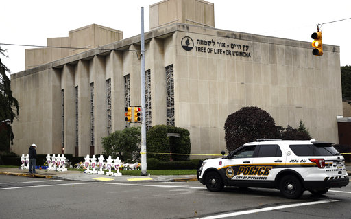 A police vehicle is posted near the Tree of Life/Or LSimcha Synagogue in Pittsburgh, Monday, Oct. 29, 2018. Tree of Life shooting suspect Robert Gregory Bowers is expected to appear in federal court Monday. Authorities say he expressed hatred toward Jews during the rampage Saturday morning and in later comments to police. (AP Photo/Matt Rourke)