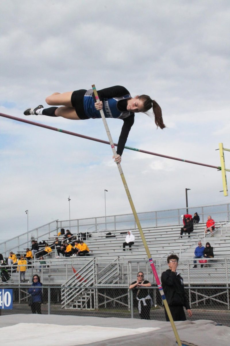 Senior Lilly Engler competing in pole vault