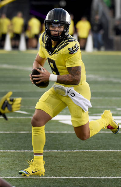 EUGENE, OREGON - OCTOBER 04: Quarterback Dillon Gabriel #8 of the Oregon Ducks runs the ball in for a touchdown at Autzen Stadium on October 04, 2024 in Eugene, Oregon. (Photo by Steve Dykes/Getty Images)