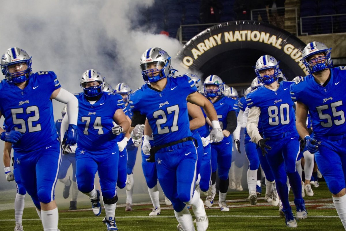 Senior Austin Stamp leads the team out of the tunnel. Stamp was named a third team All-Ohio linebacker. "Football is a brotherhood," Stamp said. "Everything we do is done together and for each other."