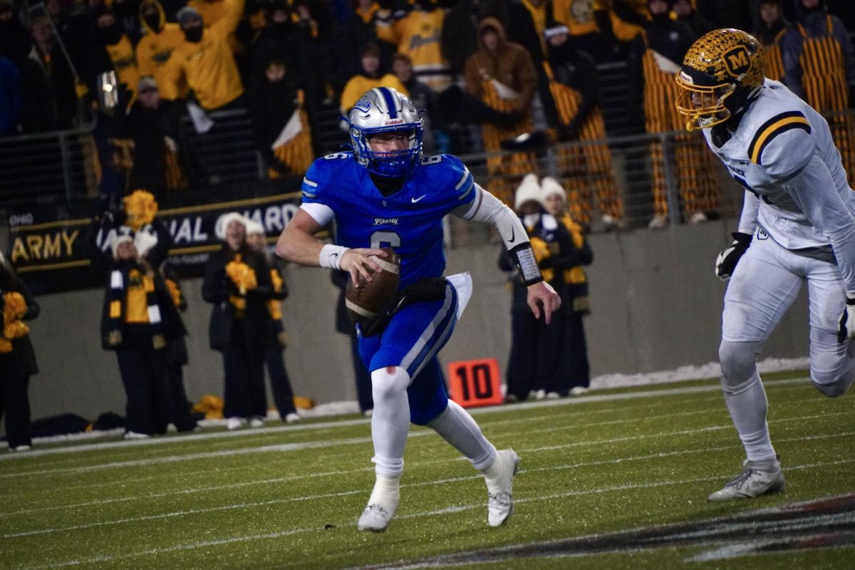 Senior quarterback Andrew Leonard '25 scrambles out of the pocket to avoid pressure. Leonard threw for 274 yards and three touchdowns. "This team means everything," Leonard said. "Being close with your teammates is what gets you through rough times."