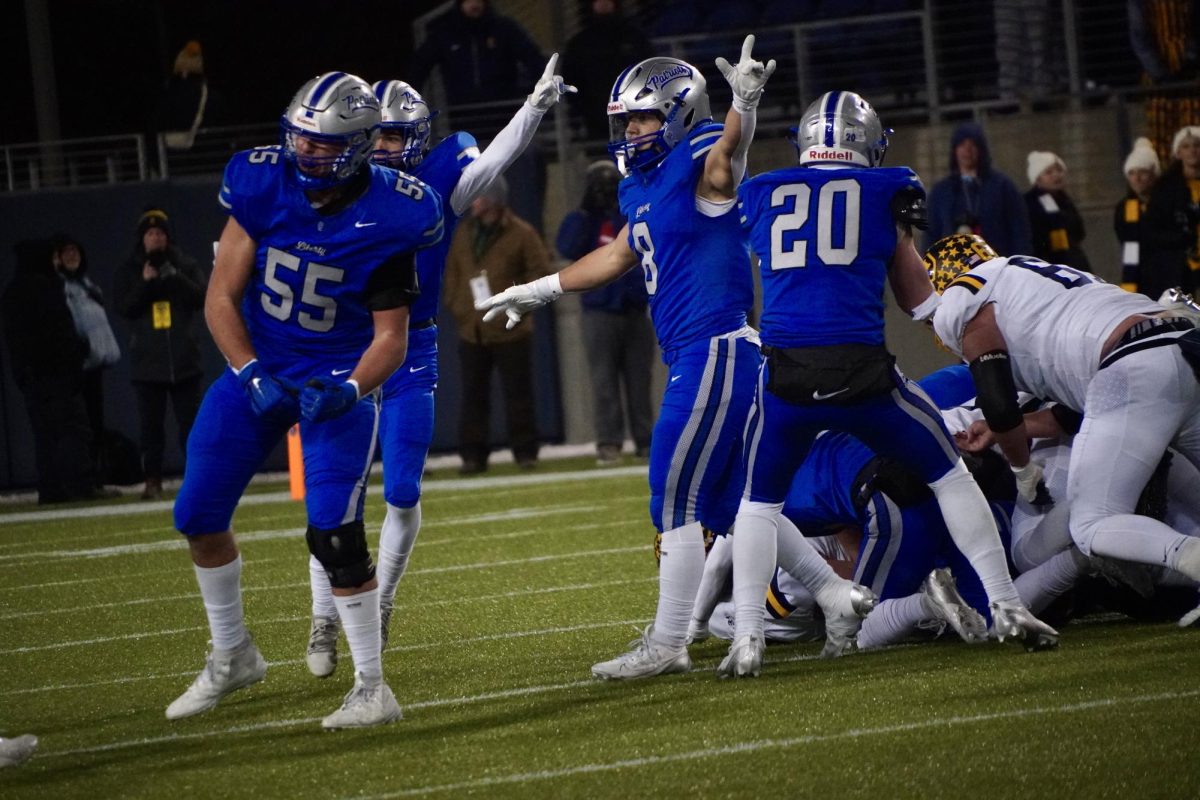 The defense celebrates a turnover. This was the first of two turnovers in the game. "There's no other sport where you get to hit people for sixty minutes straight," Bailey Byrd '25 said. "It teaches you countless life lessons along the way."