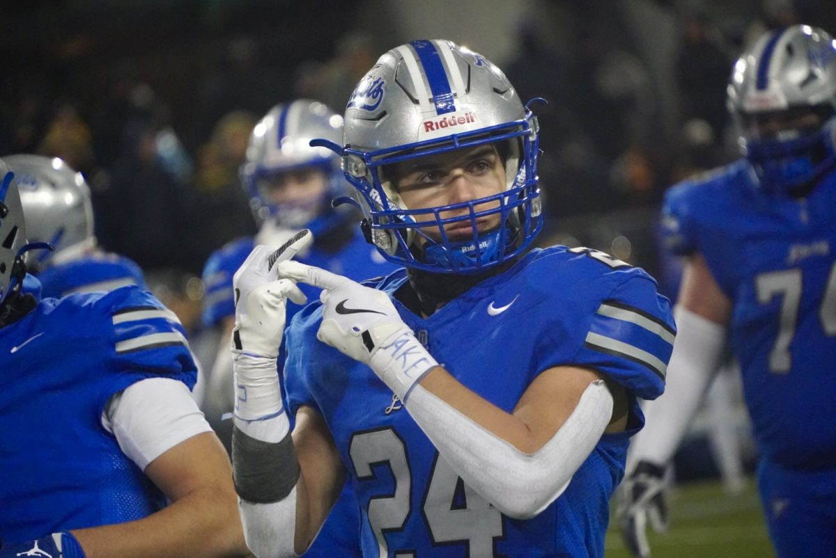 Junior defensive back Antonio Kish celebrates one final time before coming off the field for the last offensive snaps. Kish pointed at his ring finger, indicating that they were about to become champions. "[Winning a State Championship is] an incredible feeling, words can't even describe it," Kish said. "It's one of the best things that I could have ever imagined."