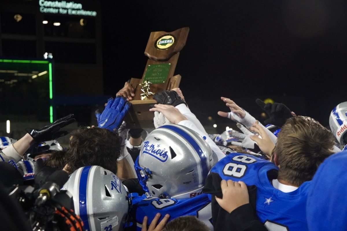 Patriots hold up their trophy after being crowned State Champions. Players of the game were awarded to First Team All-Ohio's Andrew Leonard, Second Team's Christian Moulton, and Honorable Mention Jake Struck.