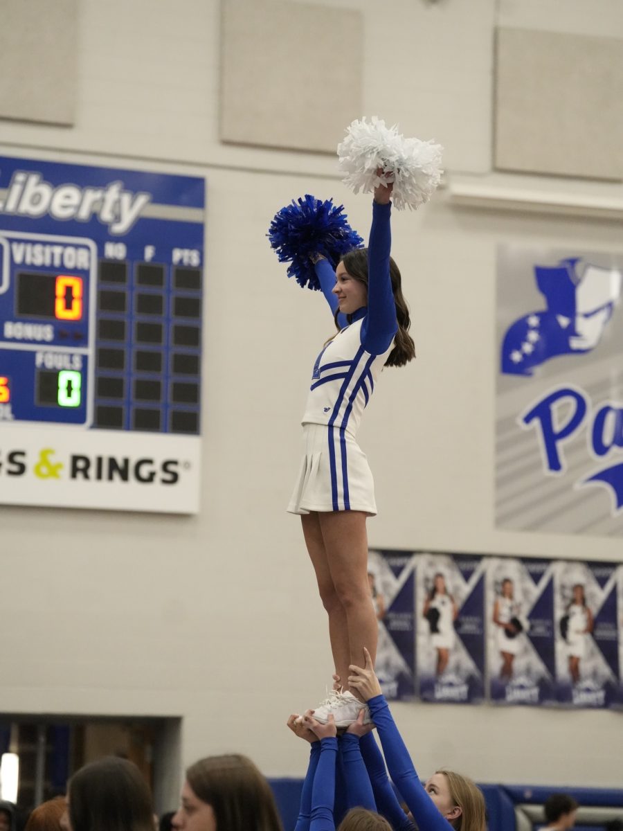 Cheerleaders preforming during the basketball game. 