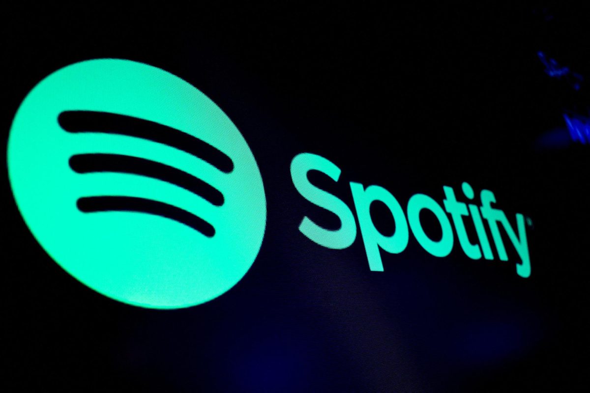FILE PHOTO:A screen displays the logo of Spotify on the floor at the New York Stock Exchange (NYSE) in New York City, U.S., December 4, 2023.  REUTERS/Brendan McDermid/ File Photo