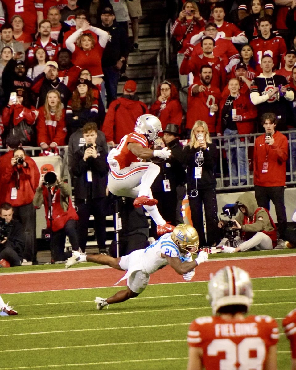 Sophomore running back James Peoples hurdles over the defender for a touchdown. Peoples took 6 handoffs for 42 yards and 2 touchdowns.