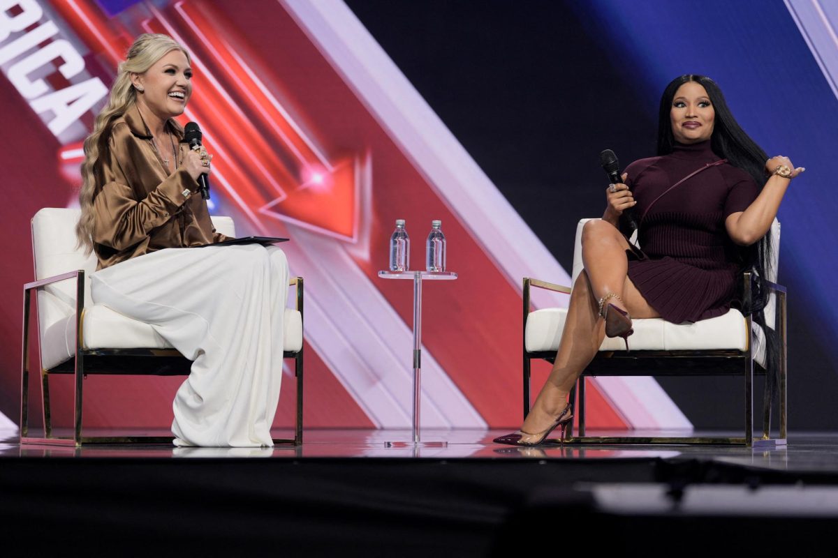 Erika Kirk speaks with Nicki Minaj during AmericaFest, the first Turning Point USA summit since the death of Charlie Kirk, in Phoenix, Arizona, U.S., December 21, 2025.  REUTERS/Cheney Orr