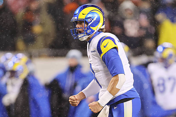 CHICAGO, ILLINOIS - JANUARY 18: Matthew Stafford #9 of the Los Angeles Rams reacts after a touchdown against the Chicago Bears during the first quarter in the NFC Divisional Playoffs at Soldier Field on January 18, 2026 in Chicago, Illinois.  (Photo by Michael Reaves/Getty Images)