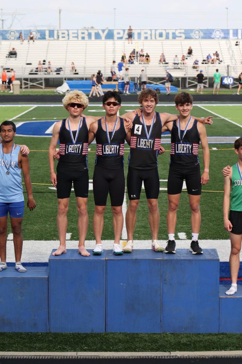 Listed from Left to Right: Brandon Craig '27, Ethan Hsieh 28', Gordon Kimerly 26', Caleb Legge 29' on top of podium after winning the Men's 4x1600