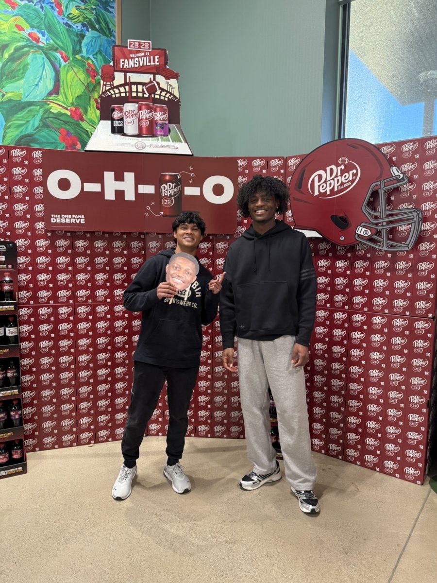 Arnav Sawant (me) with top draft prospect Carnell Tate